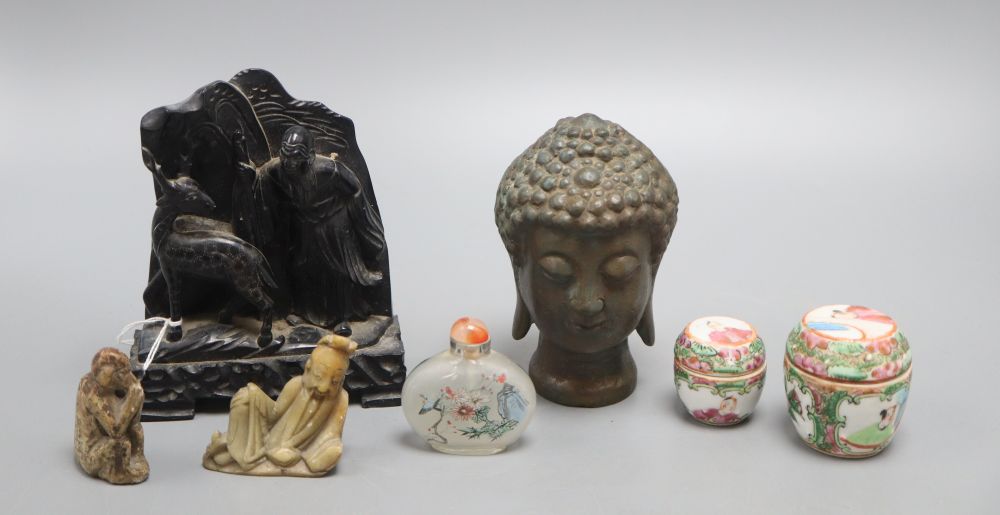 Three Chinese soapstone groups or figures and two small barrels and a snuff bottle, tallest 14.5cm